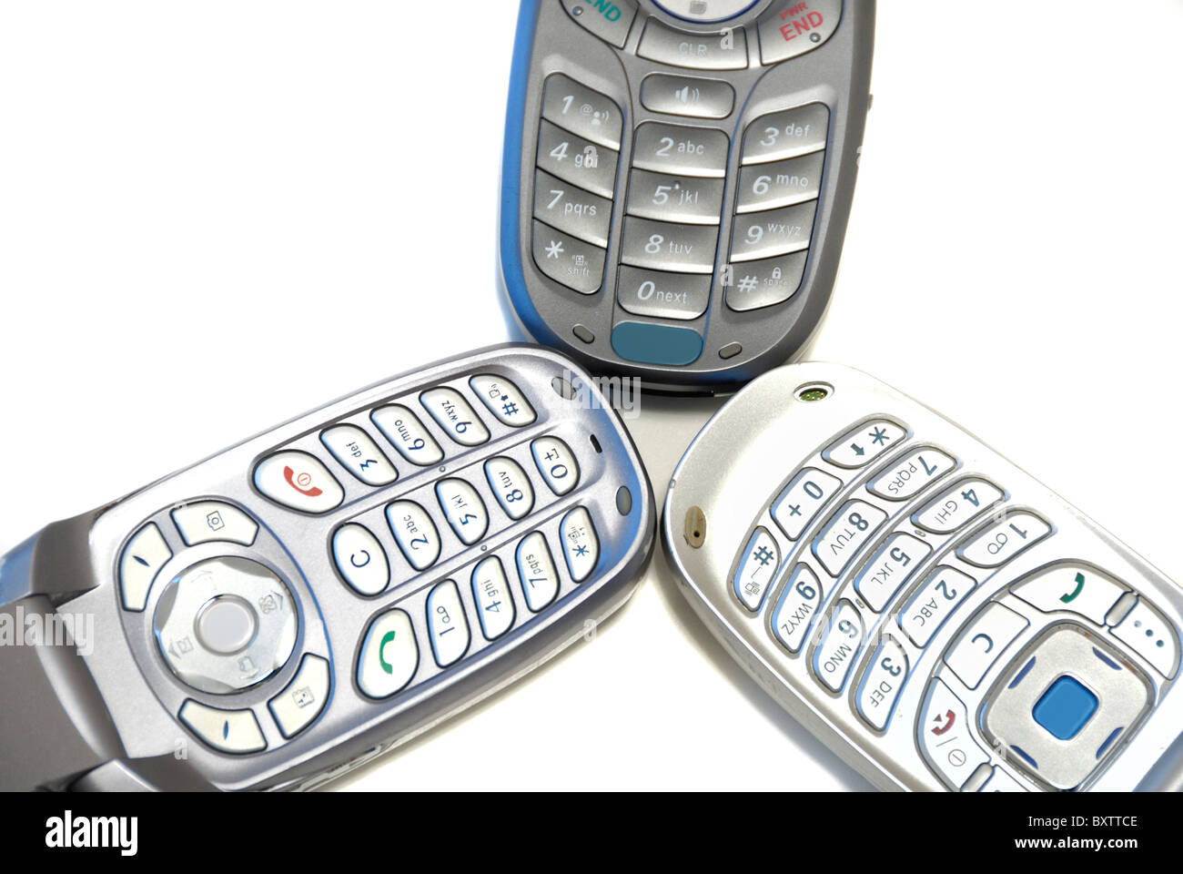 Tre i cellulari wireless su sfondo bianco Foto Stock