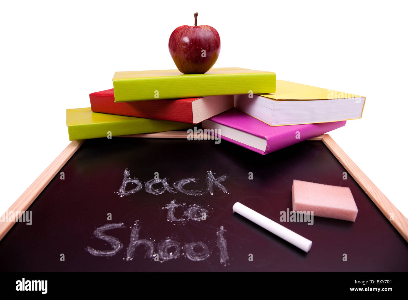 Si torna a scuola lettere scritte su una lavagna con colorati libri (messa a fuoco selettiva) Foto Stock