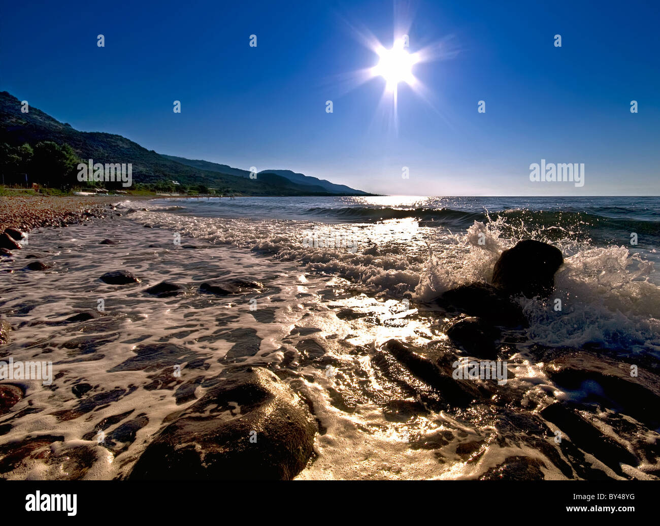 Sun Star al di sopra del Mare Egeo Foto Stock