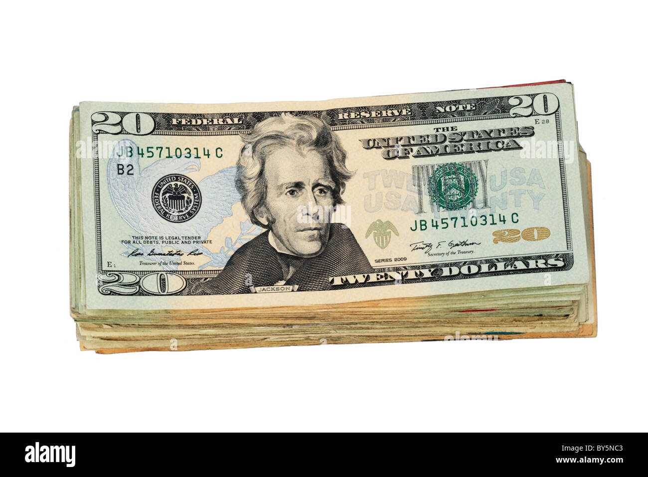 Una pila di Stati Uniti venti le fatture del dollaro isolati su sfondo bianco Foto Stock