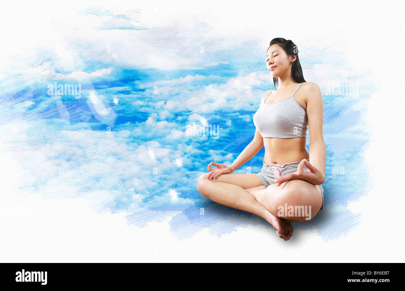 Donna che esercitano lo yoga Foto Stock
