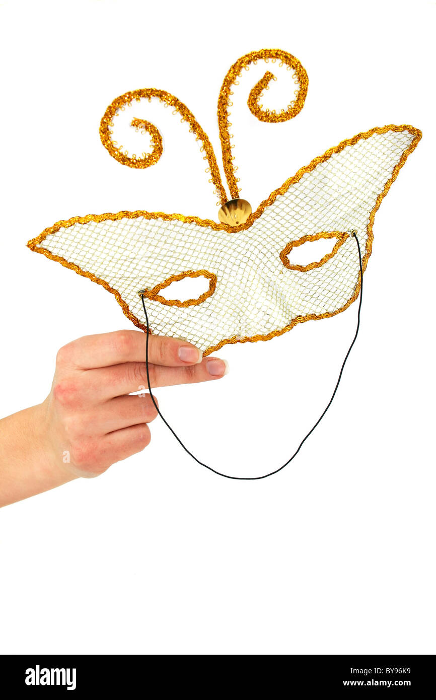 Femmina di mano azienda masquerad mask Foto Stock