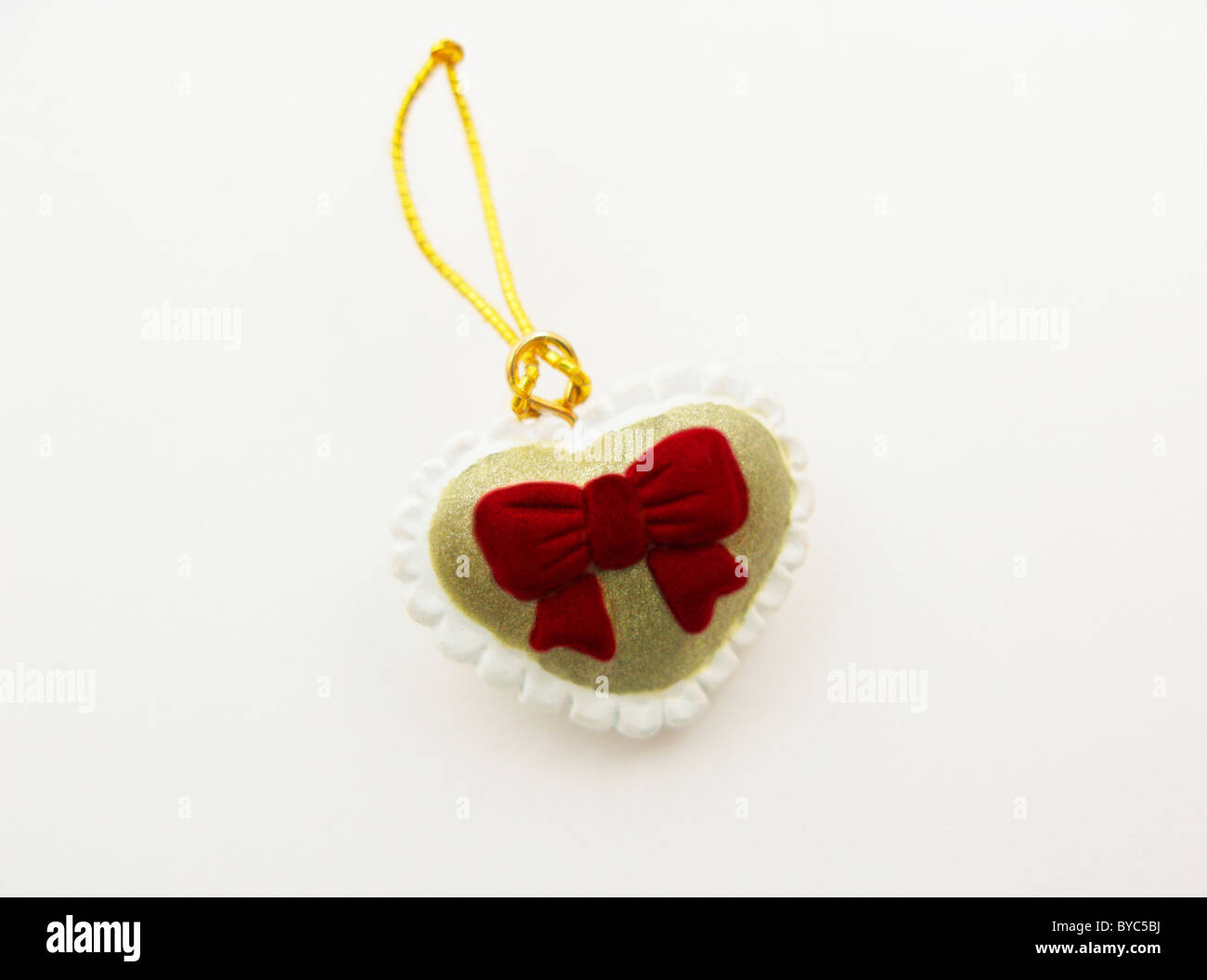 A forma di cuore ad gingillo su sfondo bianco Foto Stock