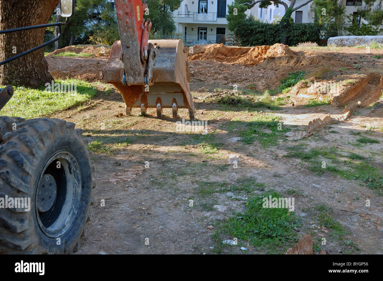 Industriale Escavatore digger macchina al sito in costruzione. Foto Stock