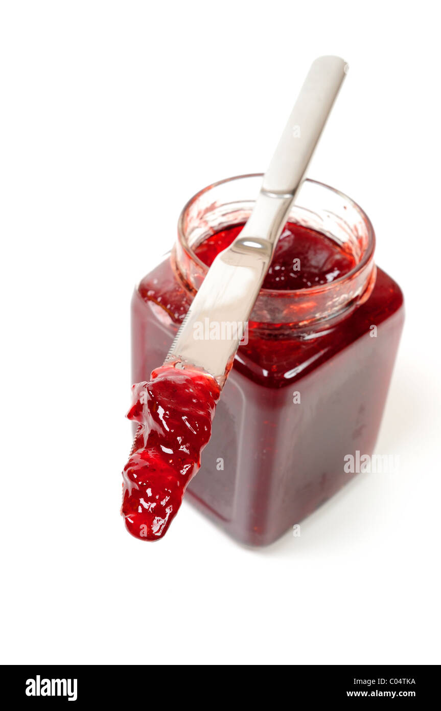 Confettura di fragole e il coltello. Foto Stock