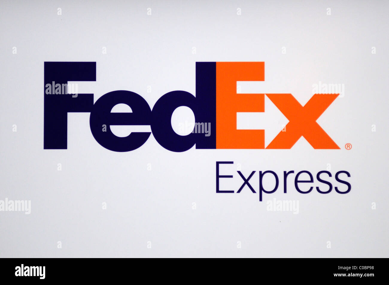 FedEx Express federale segno, il logo di Symbol, London, England, Regno Unito Foto Stock