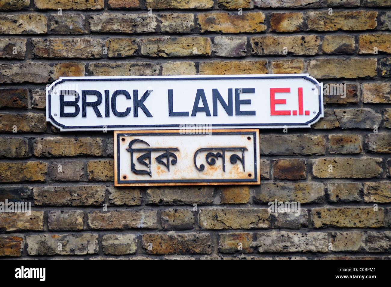 Bilingual Brick Lane E1 strada segno, London, England, Regno Unito Foto Stock