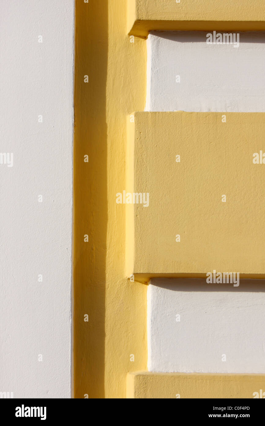 Giallo e bianco in cemento texture con un'ombra Foto Stock
