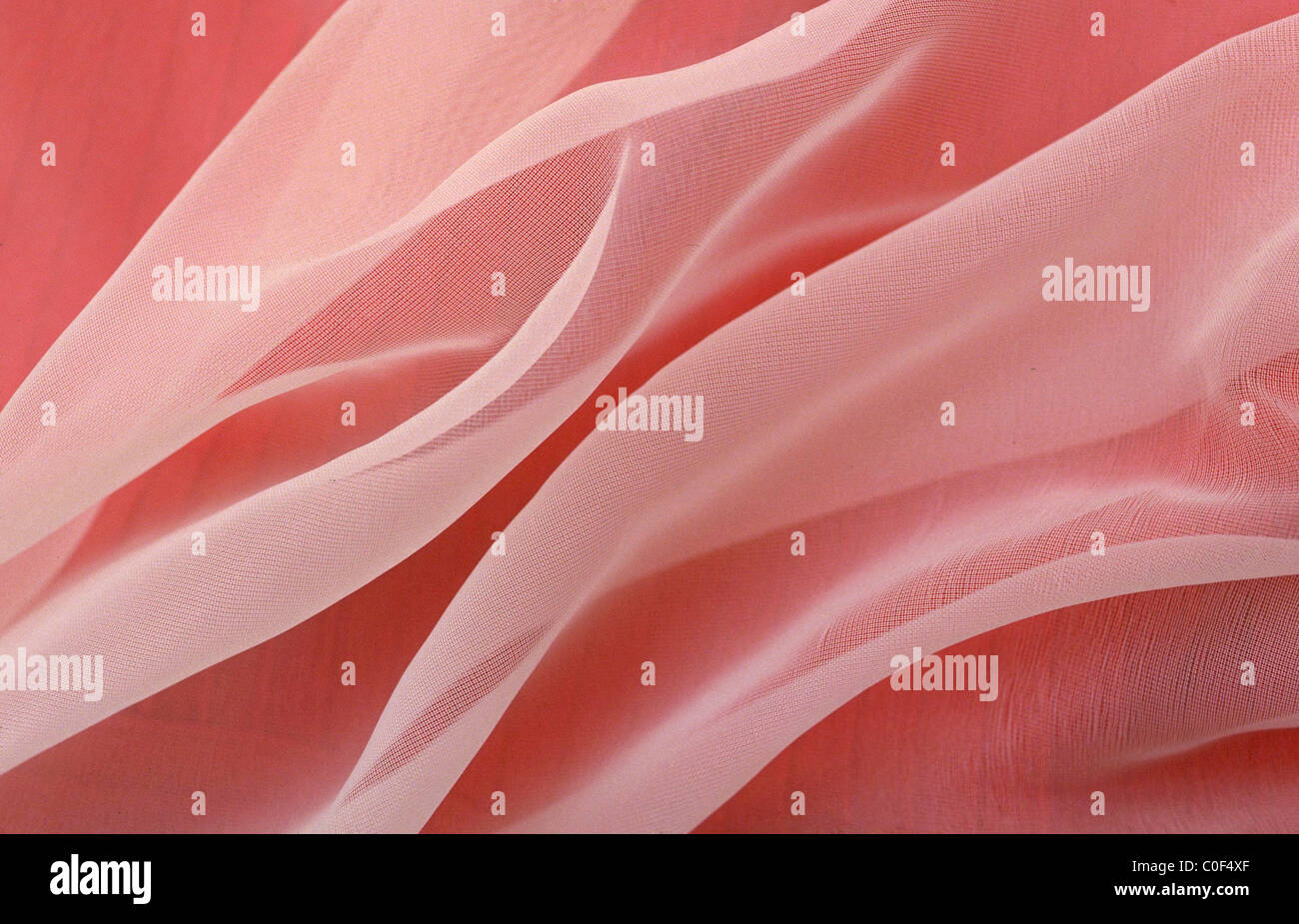 Texture organza rosa tessuto con pieghe Bellissimo Foto Stock