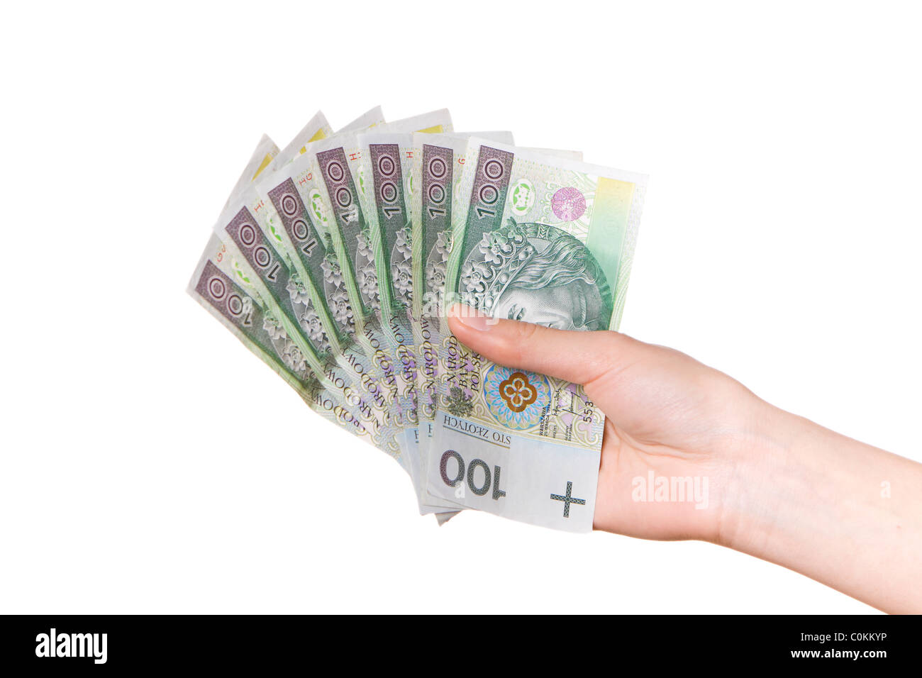La mano con il polacco denaro isolato su bianco Foto Stock