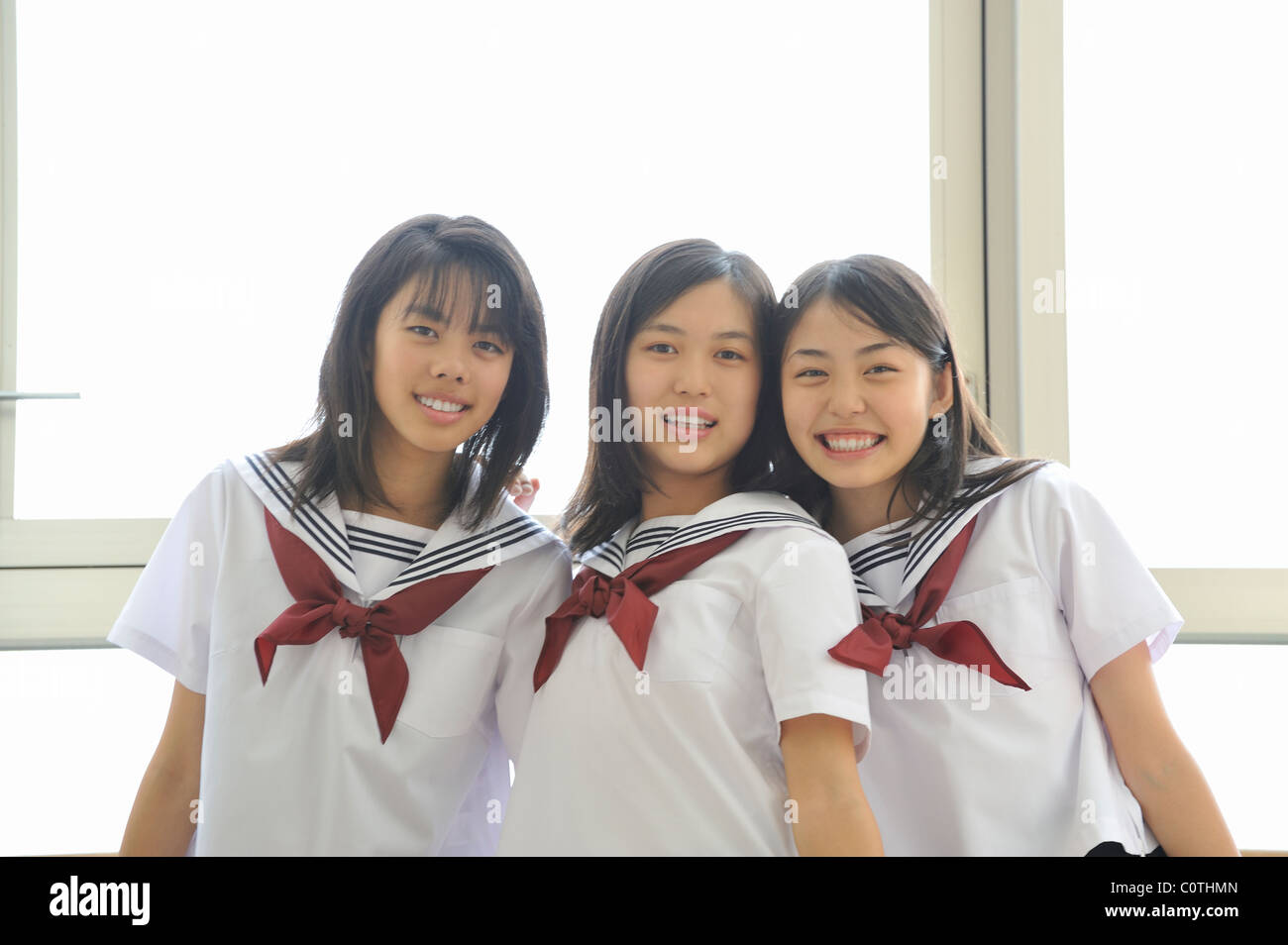 Alta scuola ragazze sorridenti Foto Stock