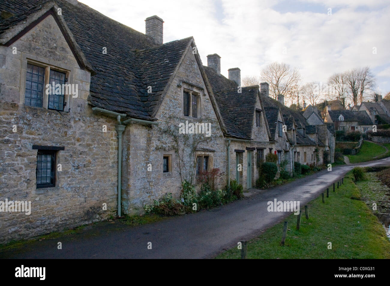 Arlington Row, un ben noto fila di cottages in Bibury, Cotswolds. Foto Stock