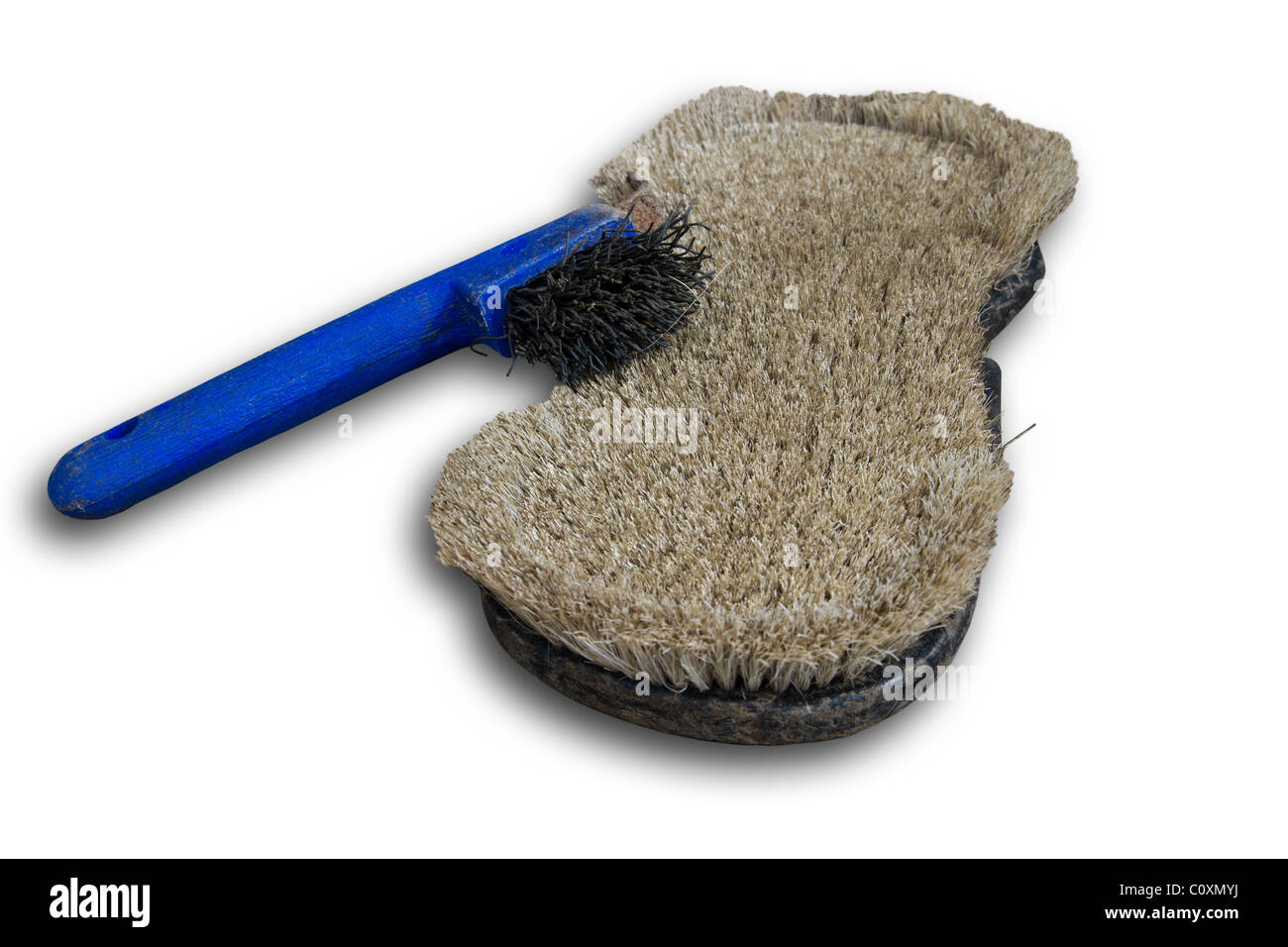 Striglia in ferro di cavallo e scratcher isolato con piccola ombra Foto Stock