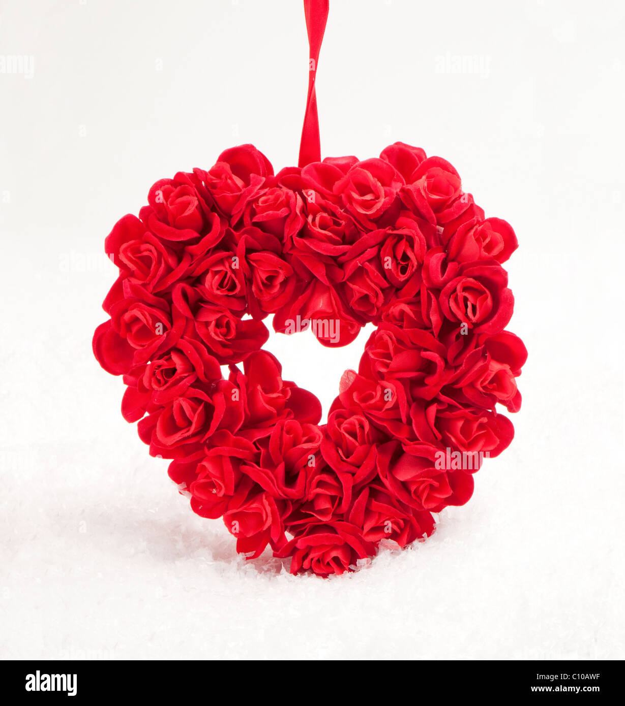 Rosso cuore di pietra di neve artificiale Foto Stock