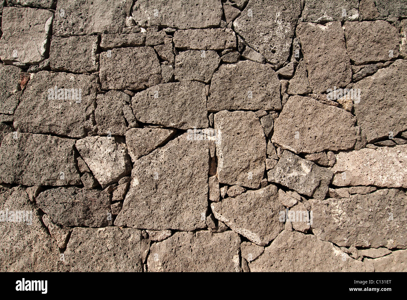 Muro di pietra , rocce laviche Foto Stock