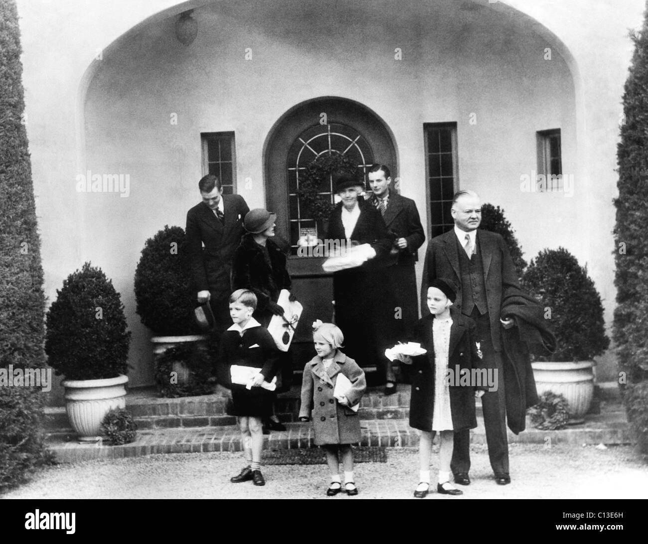 La famiglia di ex presidente Herbert Hoover: anteriore: ex presidente Herbert Hoover (destra), indietro: Herbert Hoover Jr., sua moglie Margaret Hoover, ex First Lady Lou Henry Hoover, Alan Hoover, Dicembre 25, 1933. Foto Stock