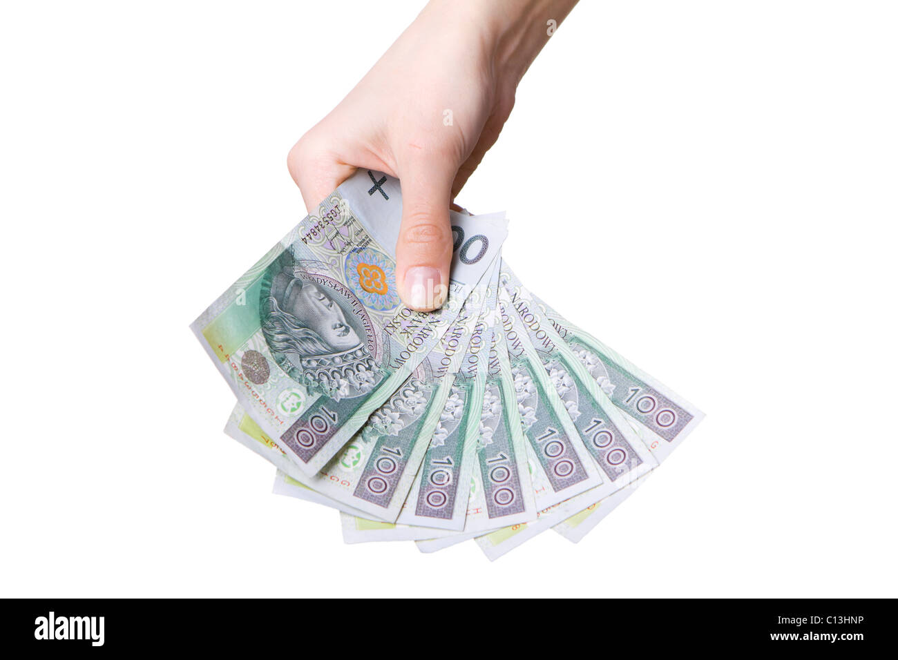 La mano con il polacco denaro isolato su bianco Foto Stock