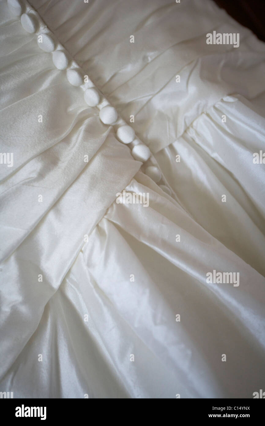 Dettaglio di abiti da sposa e pulsanti Foto Stock