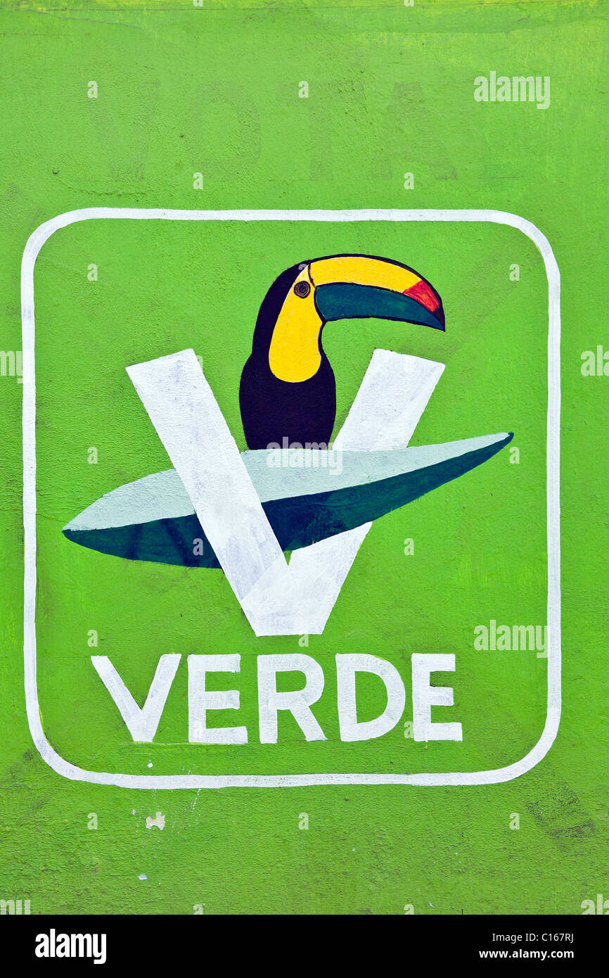 Logo della Mexican ecologico Partito Verde con Toucan bird luminoso su sfondo verde dipinto a mano pittura arte di strada sulla parete di gesso in Oaxaca Messico Foto Stock