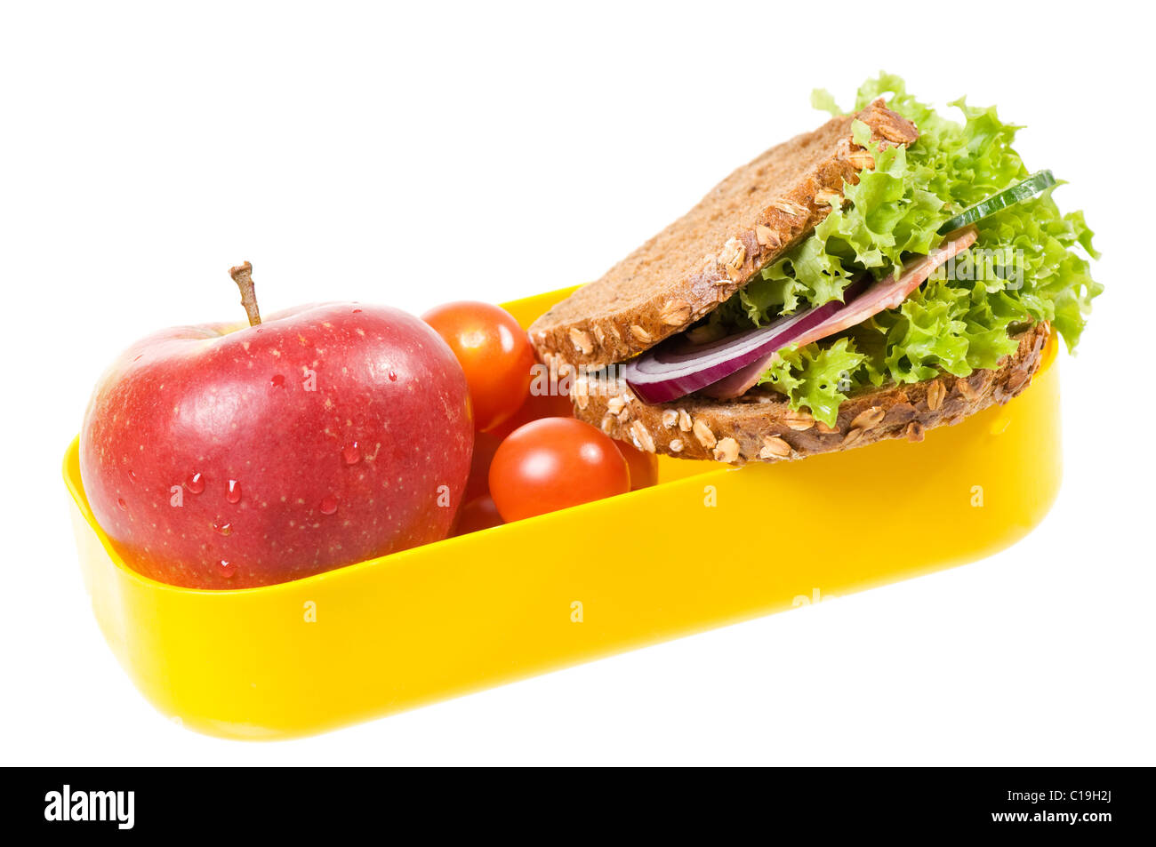 Giallo in plastica scatola di pranzo con sandwich e Apple Foto Stock