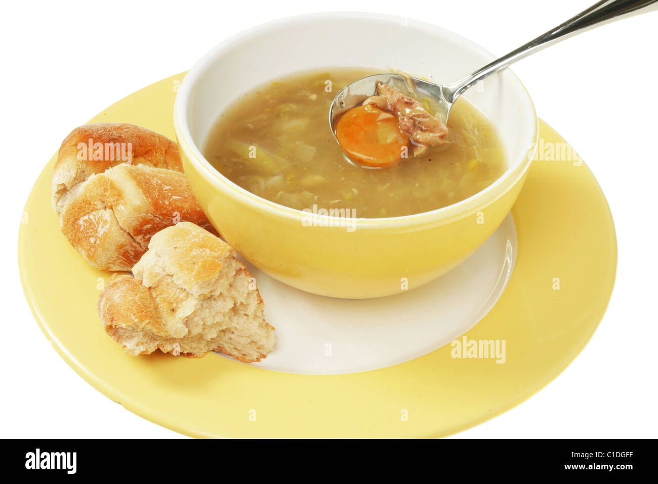Zuppa di pollo con cucchiaino ciotola,piastra e crosta di pane Foto Stock