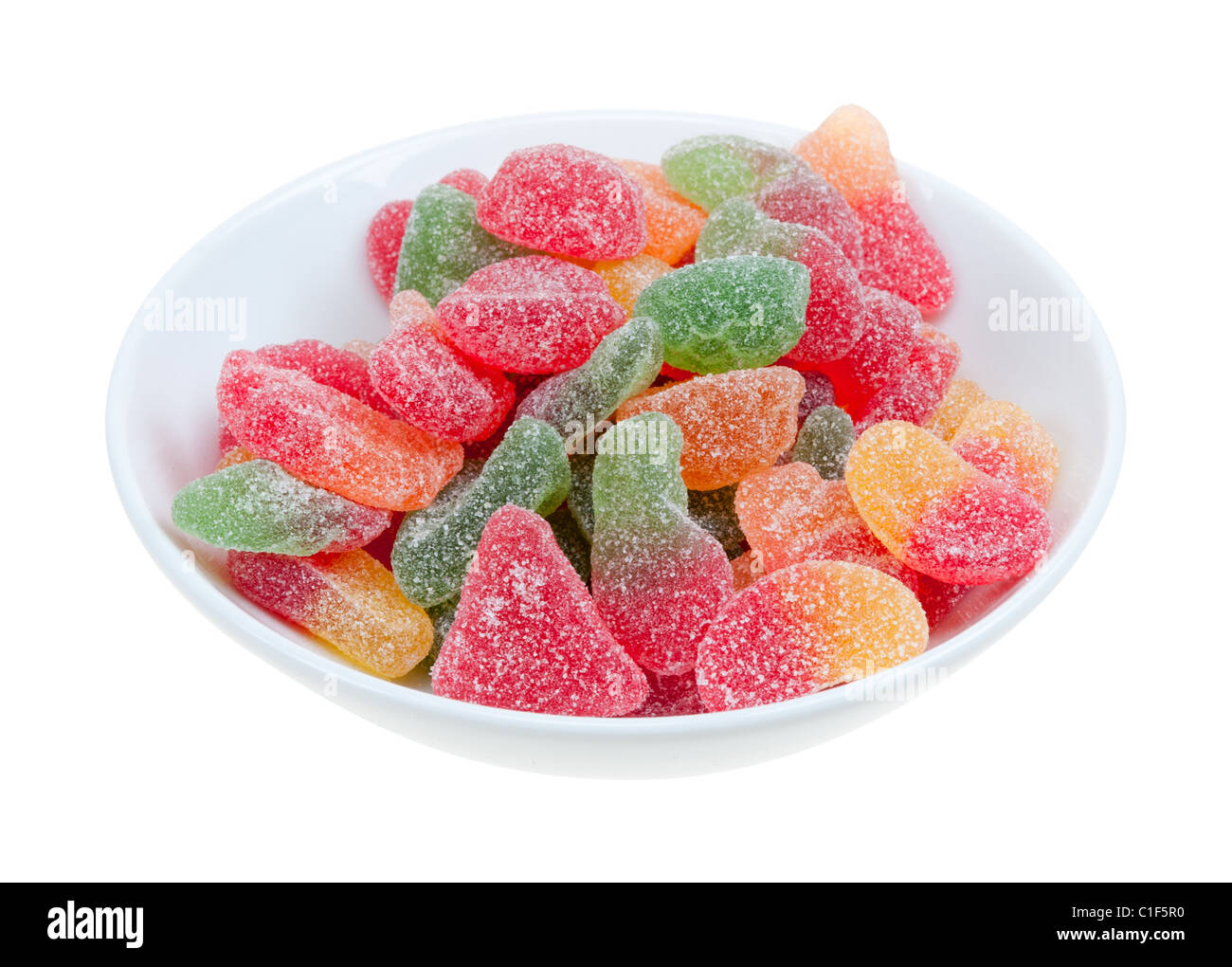 Zucchero gocce di gomma rivestito in un recipiente isolato su uno sfondo bianco Foto Stock