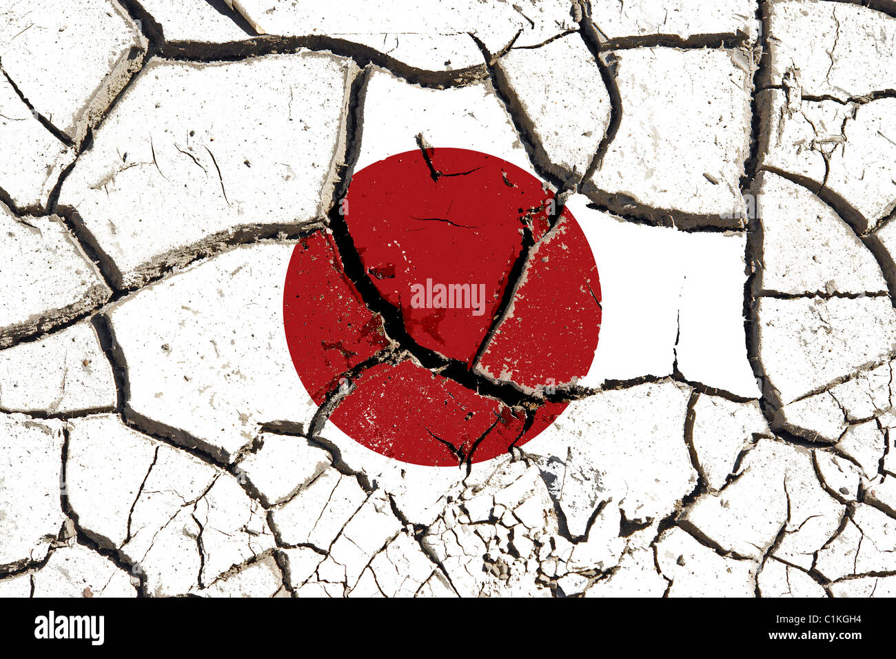Suolo incrinato come bandiera del Giappone a simboleggiare l effetto del terremoto Foto Stock