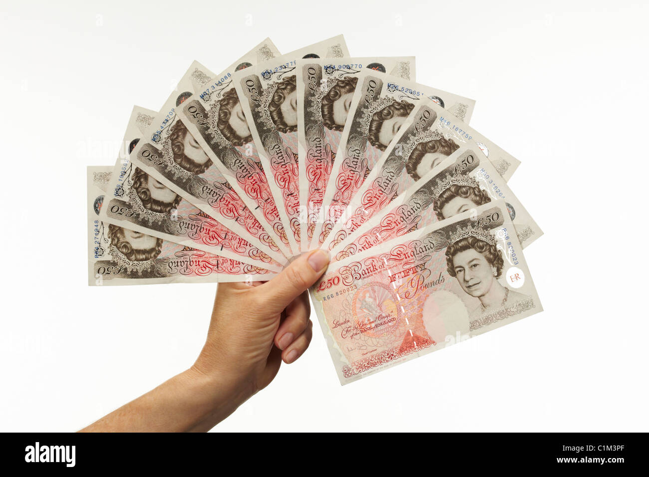 Fan di cinquanta Pound note con la mano Foto Stock