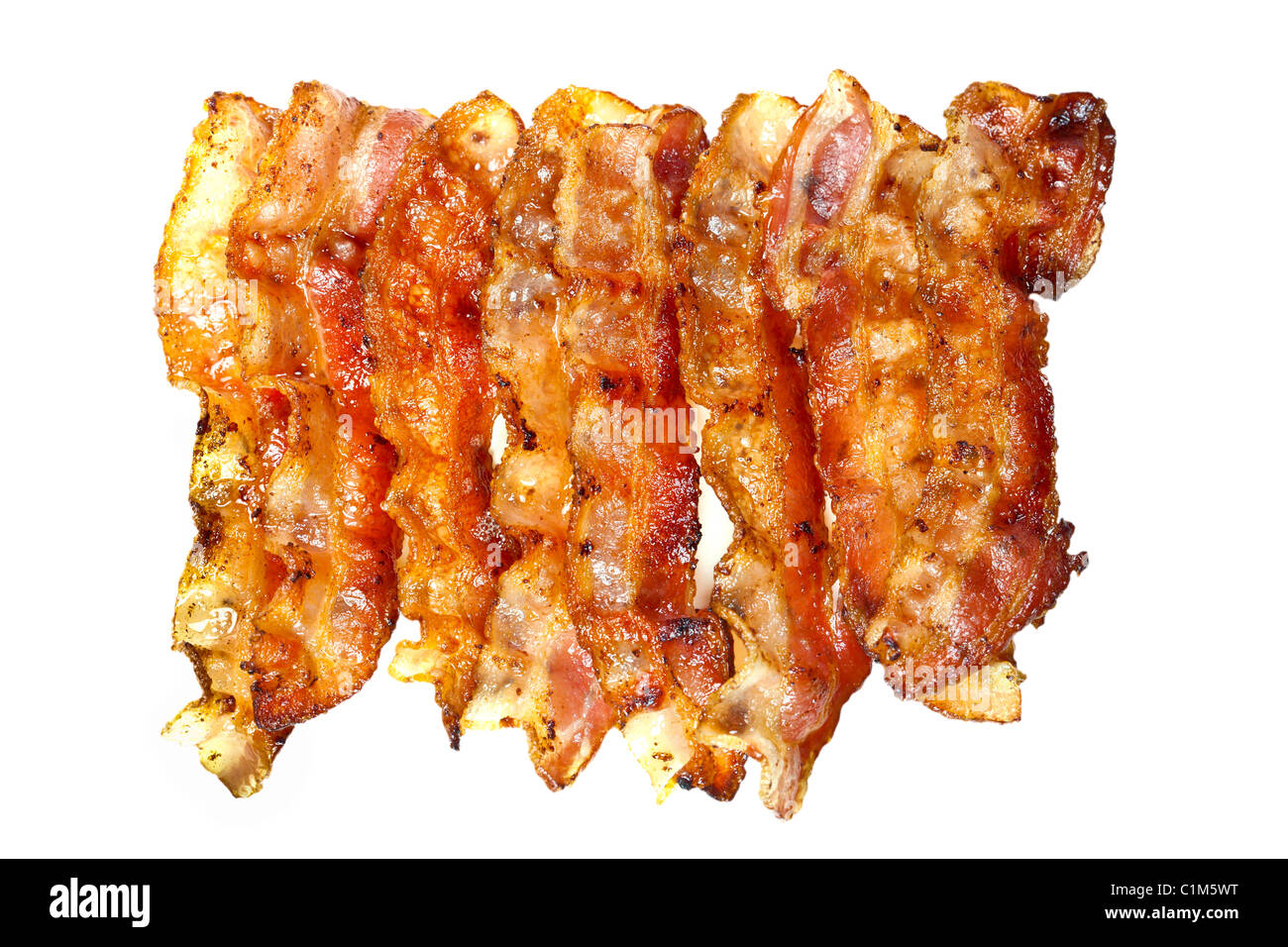 Bacon cotto isolati su sfondo bianco. Charles Lupica Foto Stock