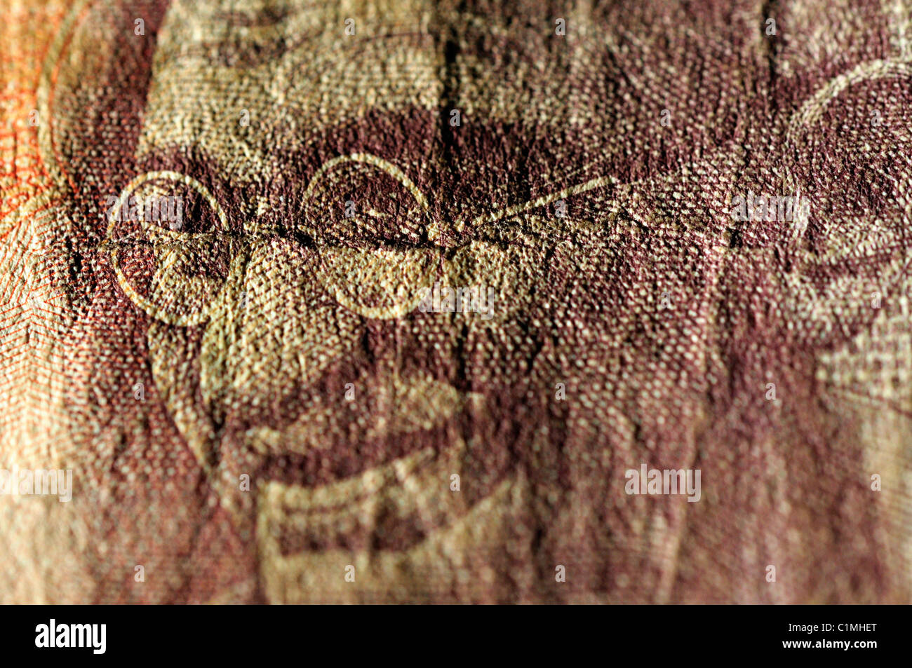 Close up di una decina di rupie nota incentrato sul Mahatma Gandhi Foto Stock