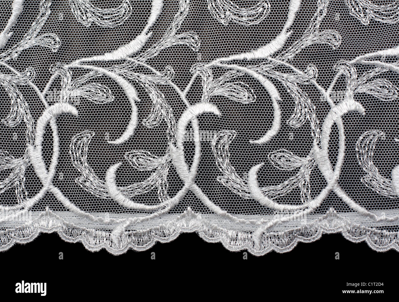 Pizzo decorativo con pattern su sfondo nero Foto Stock