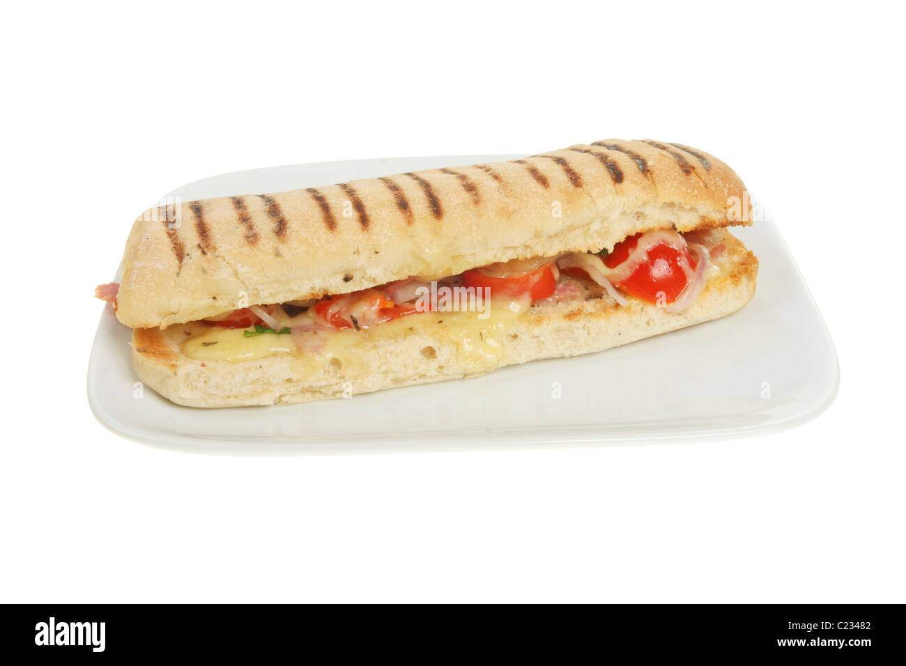 Formaggio, prosciutto e pomodoro pannini panino su una piastra Foto Stock