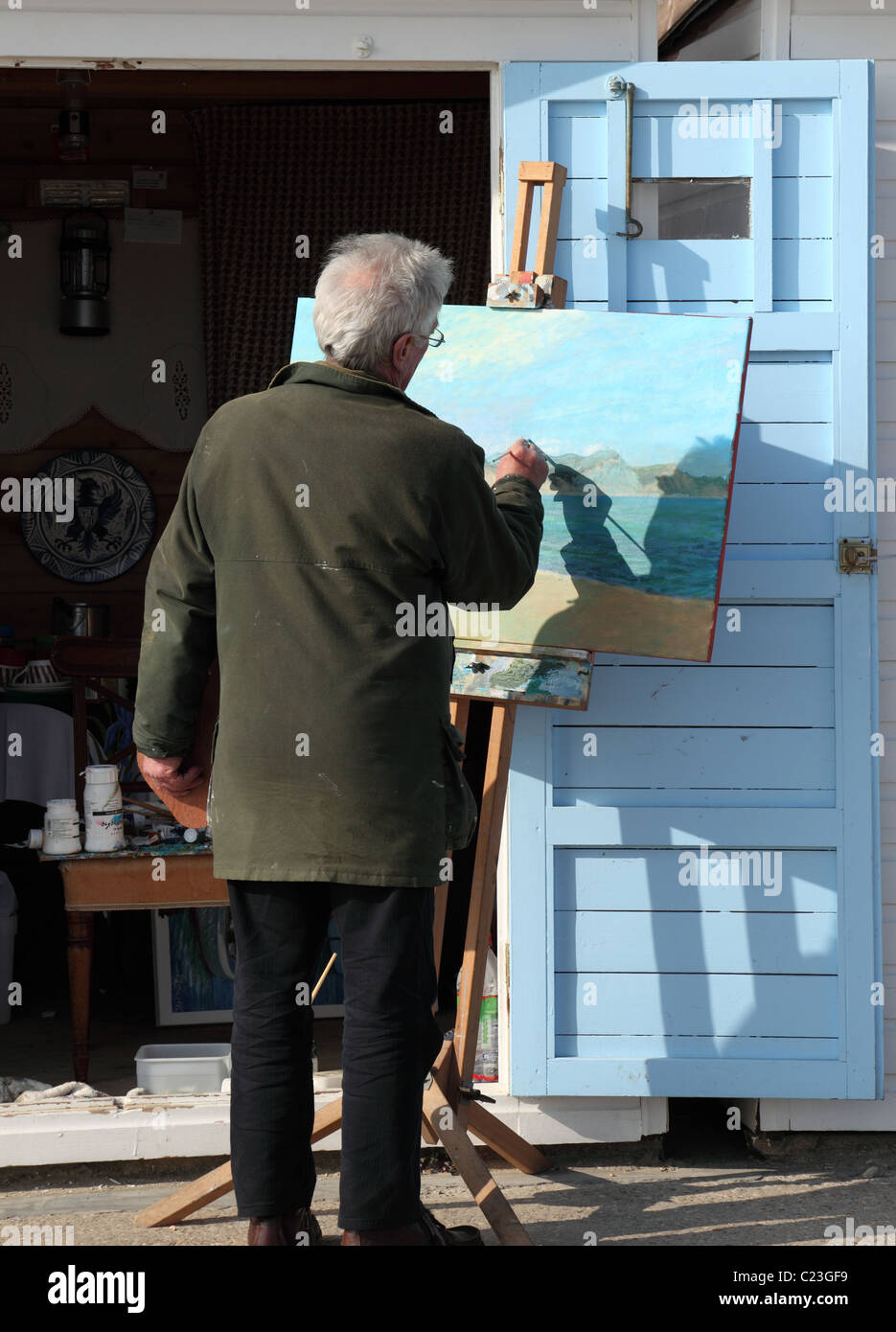 Artista al lavoro Lyme Regis, Dorset, Inghilterra Foto Stock