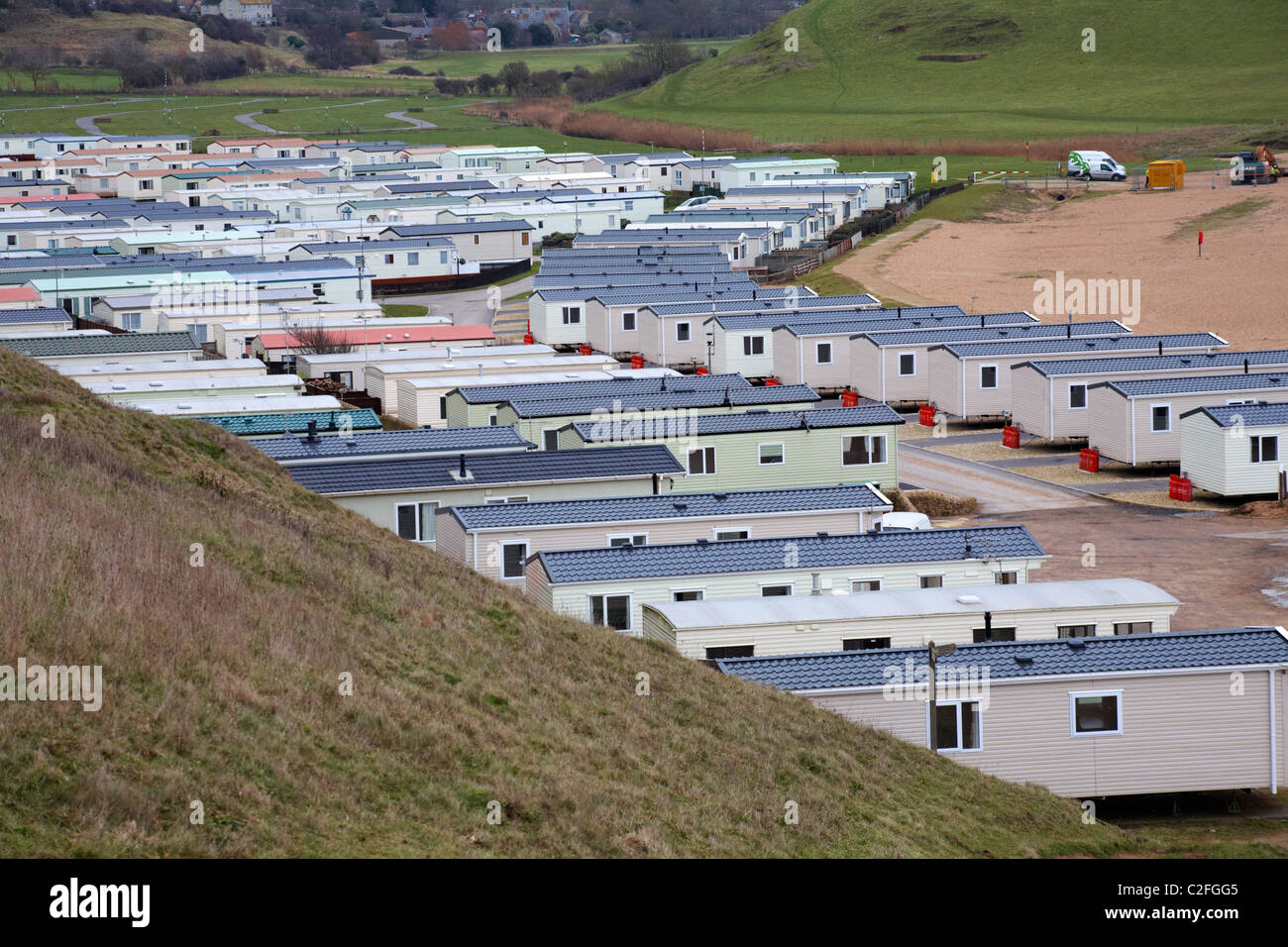 Sito di caravan mobile, parco statico di caravan, a West Bay, Dorset UK nel mese di gennaio - caravan statico case mobili Foto Stock