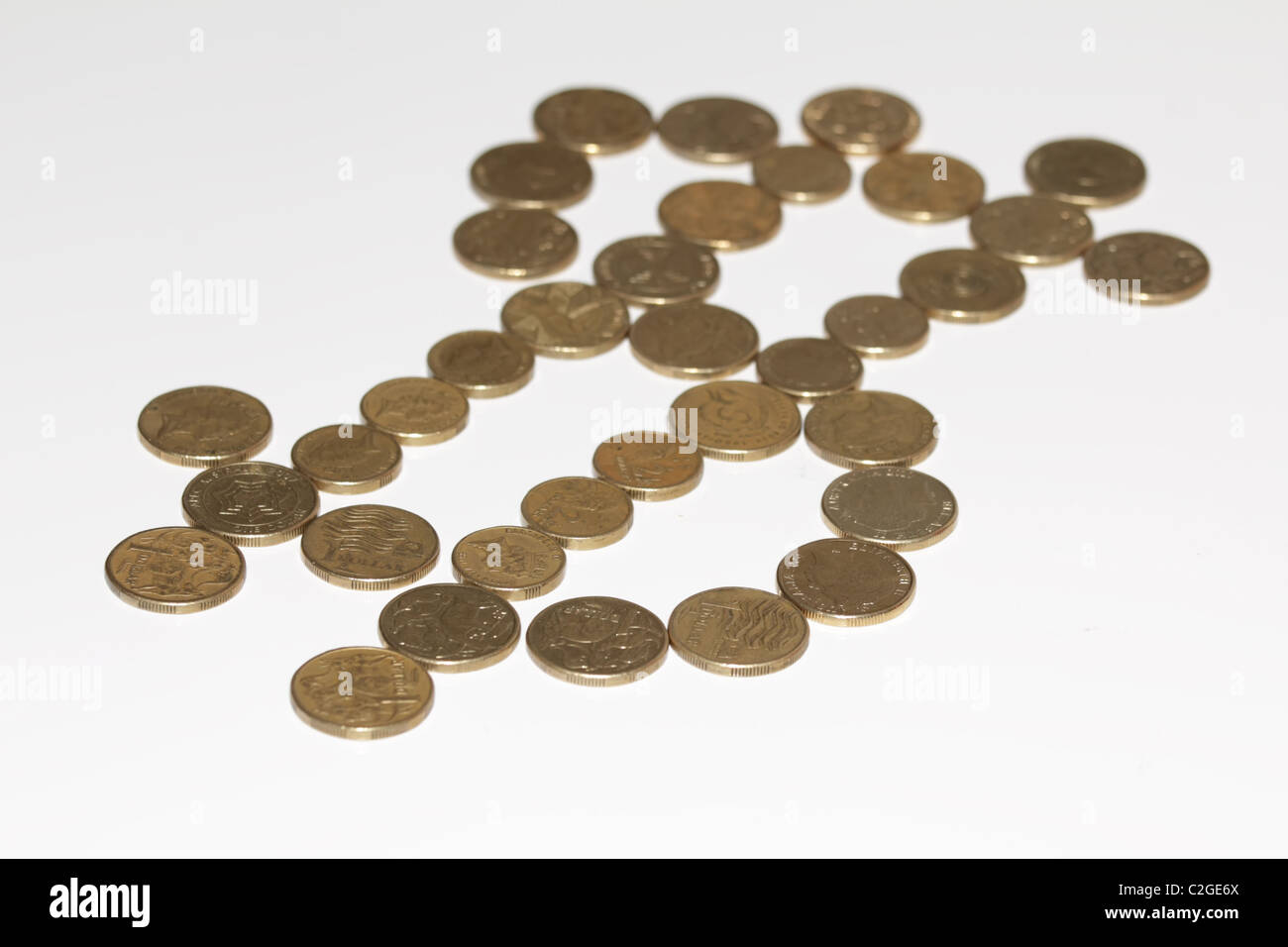 Monete del dollaro formando Dollar Sign Foto Stock