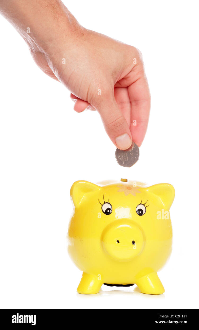 Salvataggio di cinquanta pence in un piggybank studio ritaglio Foto Stock