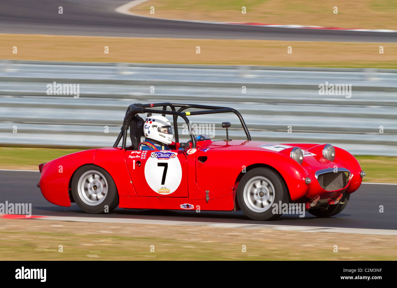 1959 Austin Healey Sprite Frogeye durante la CSCC oscillante serie degli anni Sessanta gara a Snetterton, Norfolk, Regno Unito. Foto Stock