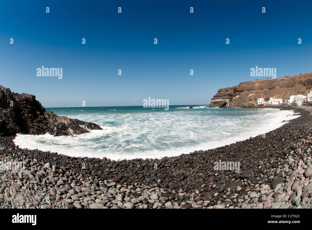 Stoney spiaggia di Los Molinos borgo peschereccio di Fuerteventura isole Canarie Foto Stock