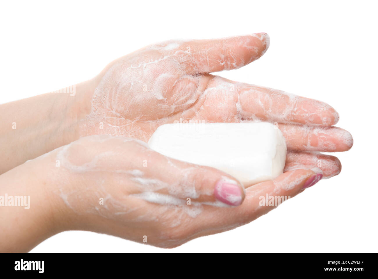 Donna di lavare le mani con sapone e schiuma isolati su sfondo bianco Foto Stock