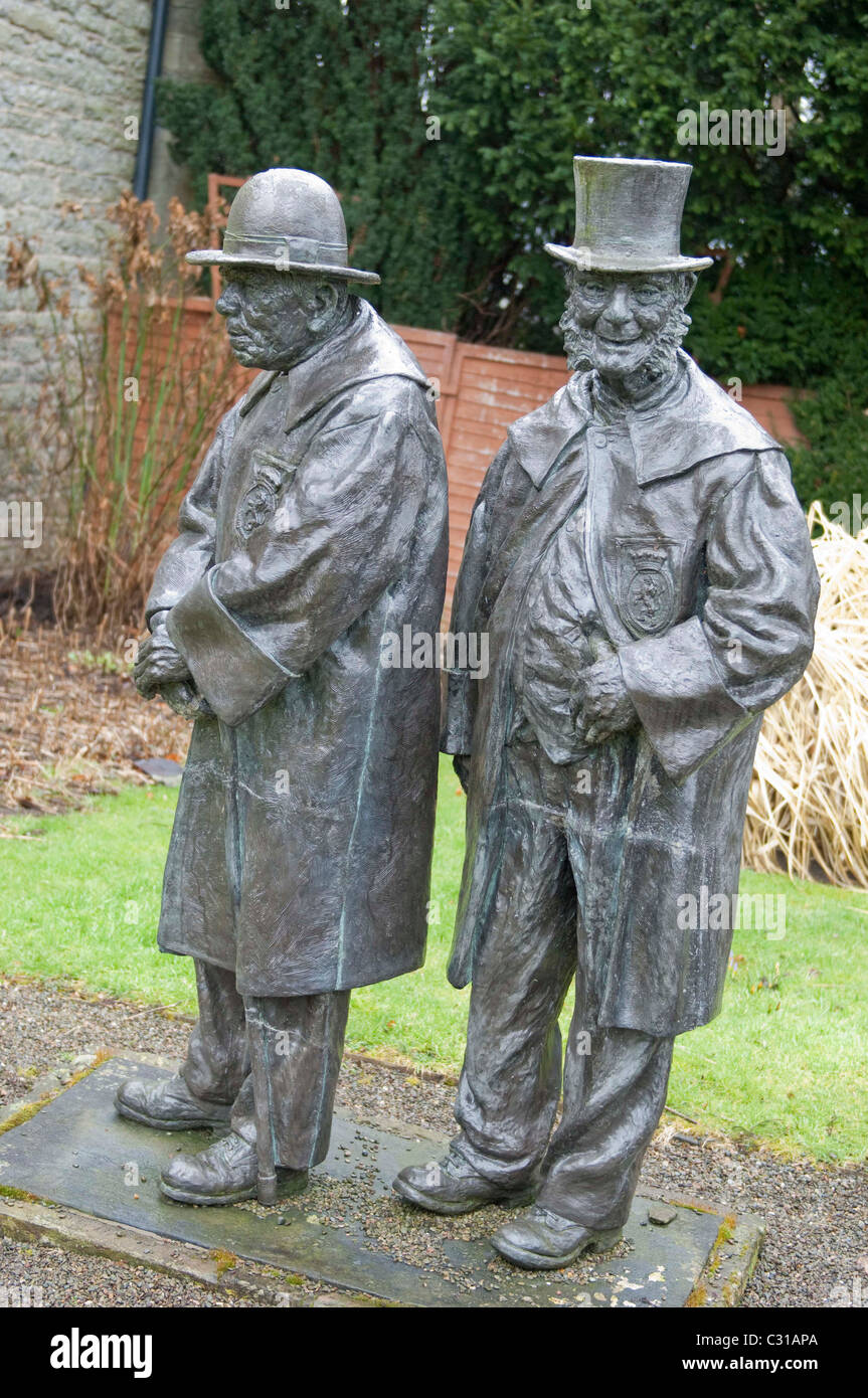 Le statue nella motivazione della Trinità Alms case, Clun, Shropshire,Inghilterra Foto Stock
