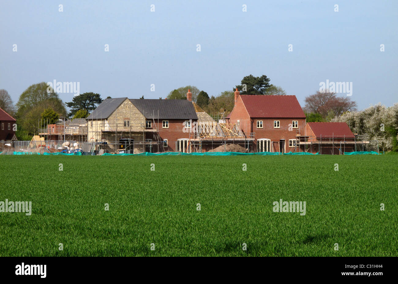 Nuove case costruite su ex terreni agricoli, Warwickshire, Inghilterra Foto Stock