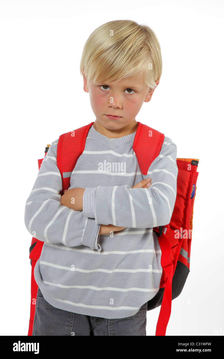 SCHOOLCHILD infelice con la sua borsa IL PRIMO GIORNO DI SCUOLA Foto Stock