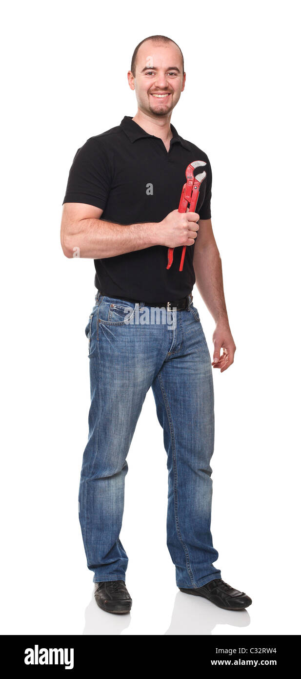 Uomo sorridente con gli occhiali tenendo un utensile rosso Foto Stock
