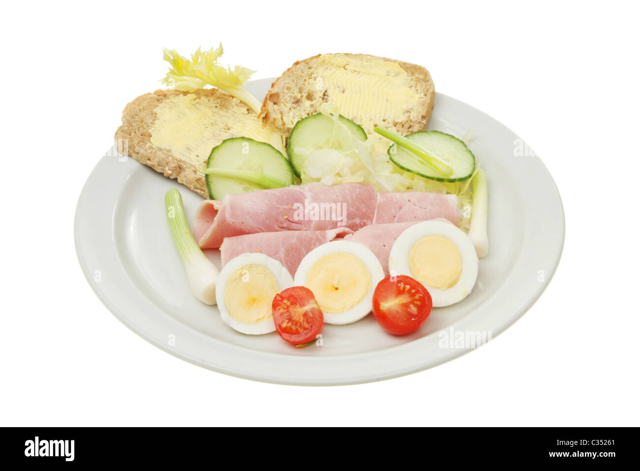 Prosciutto e uova insalata con pane e burro Foto Stock