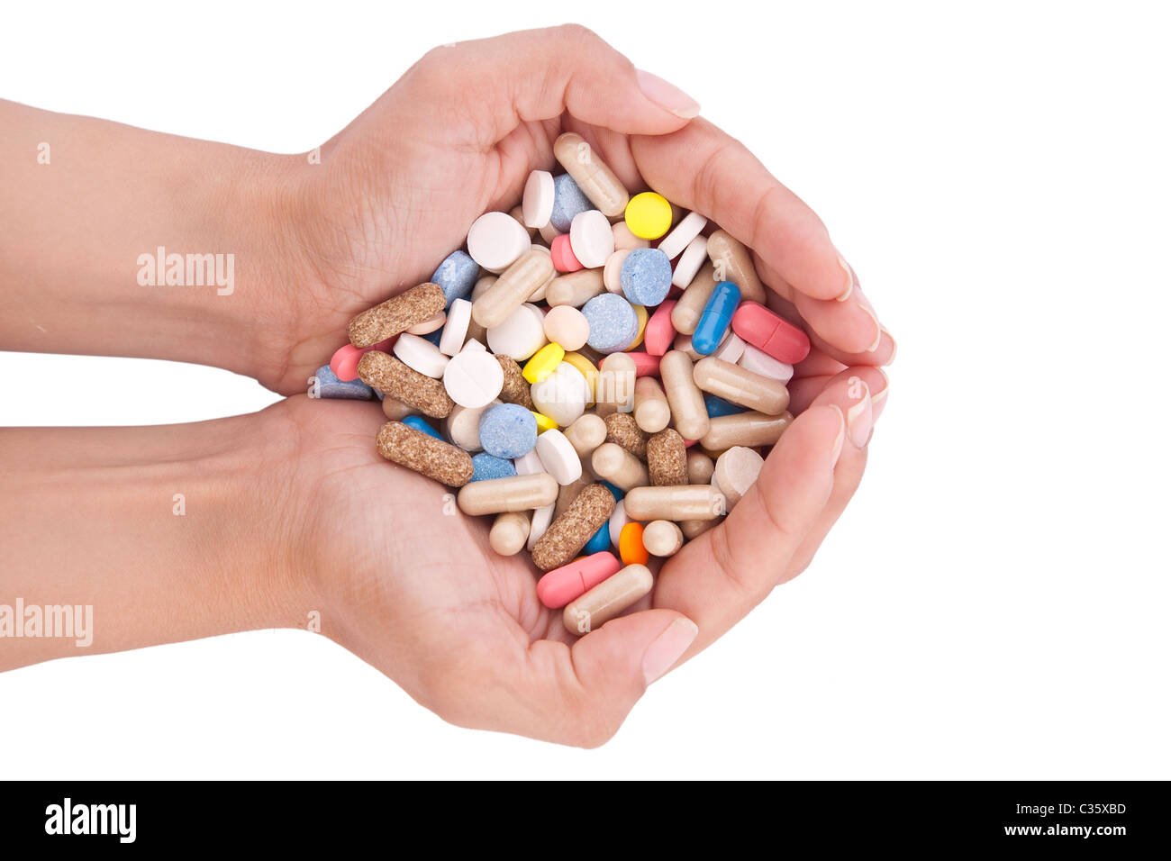 Pillole in mani isolati su sfondo bianco Foto Stock