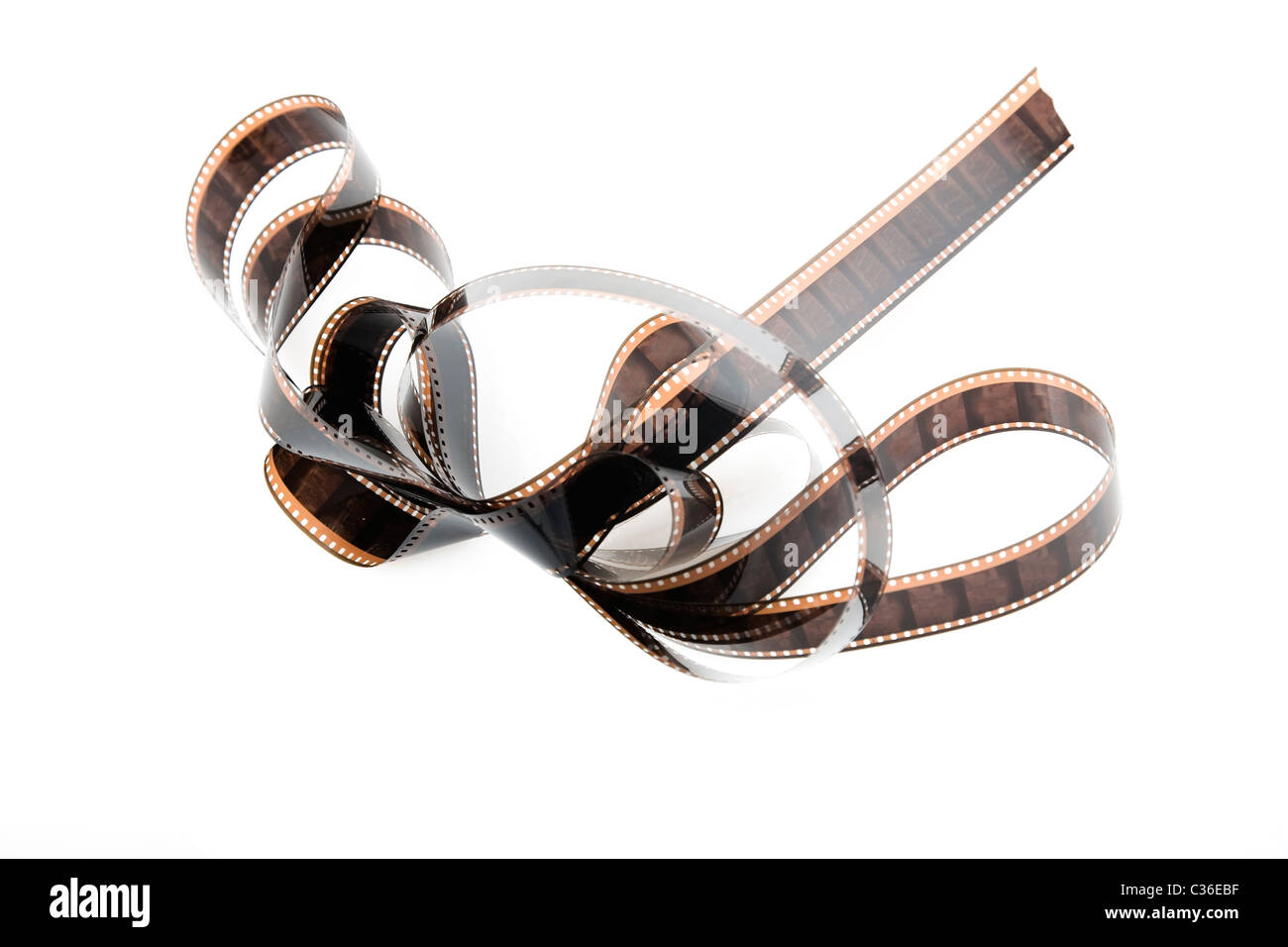 Dettagliato di close-up di una striscia di film, bobina di pellicola su bianco Foto Stock
