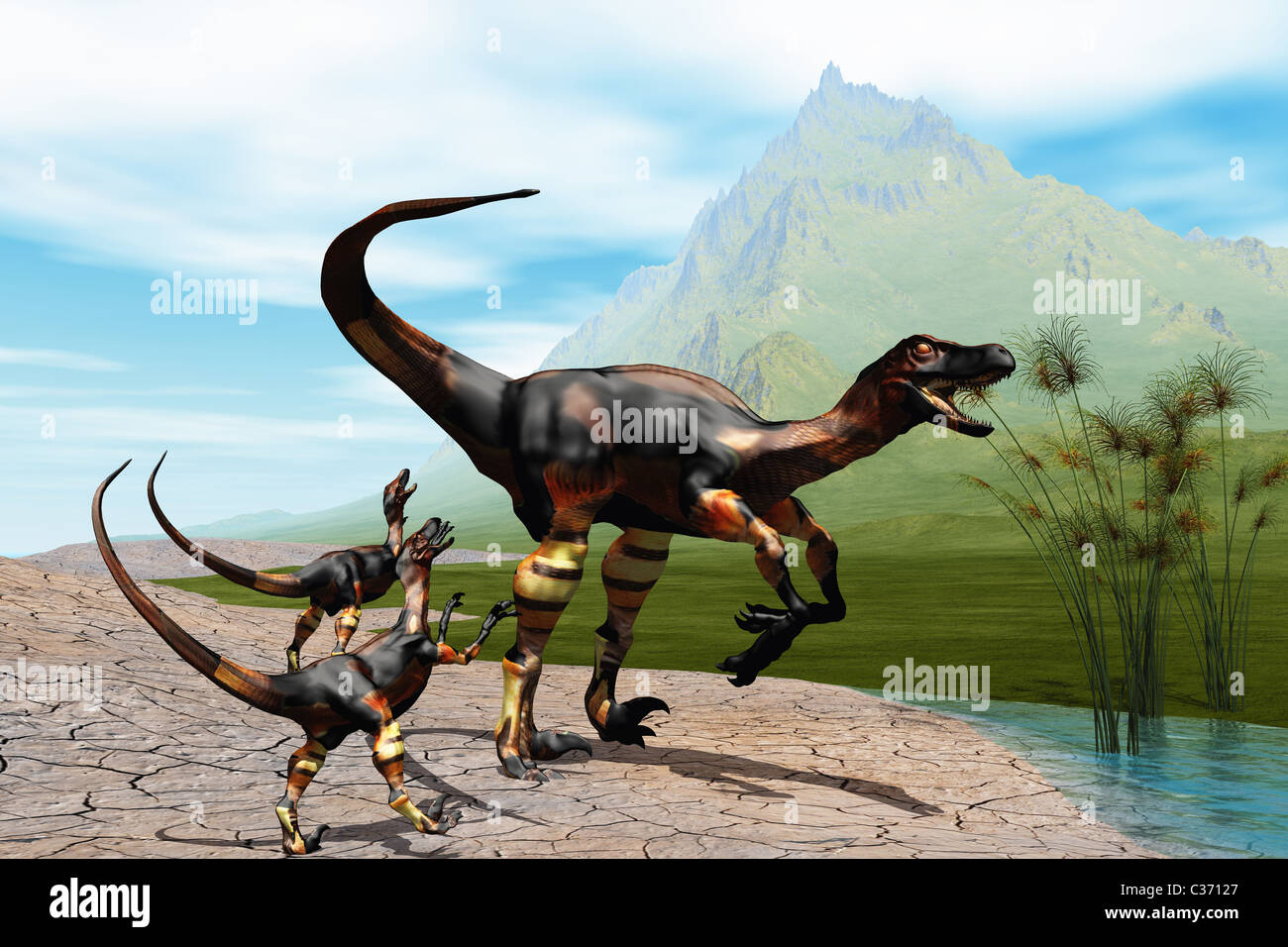 Madre Raptor dinosauro con le sue due giovani bambini. Foto Stock