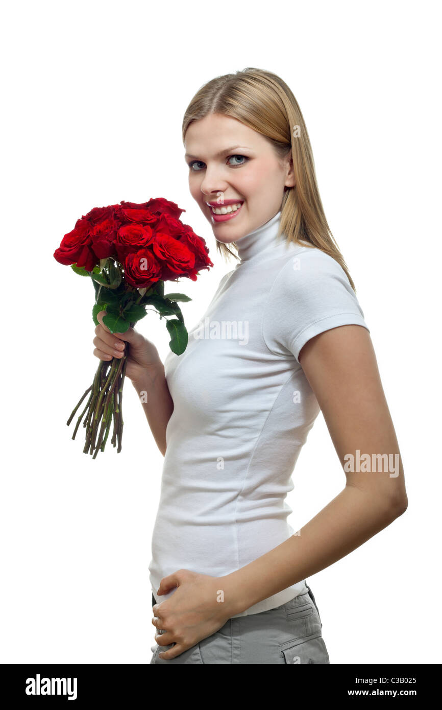 Giovane bella donna bionda tenendo un mazzo di rose rosse Foto Stock