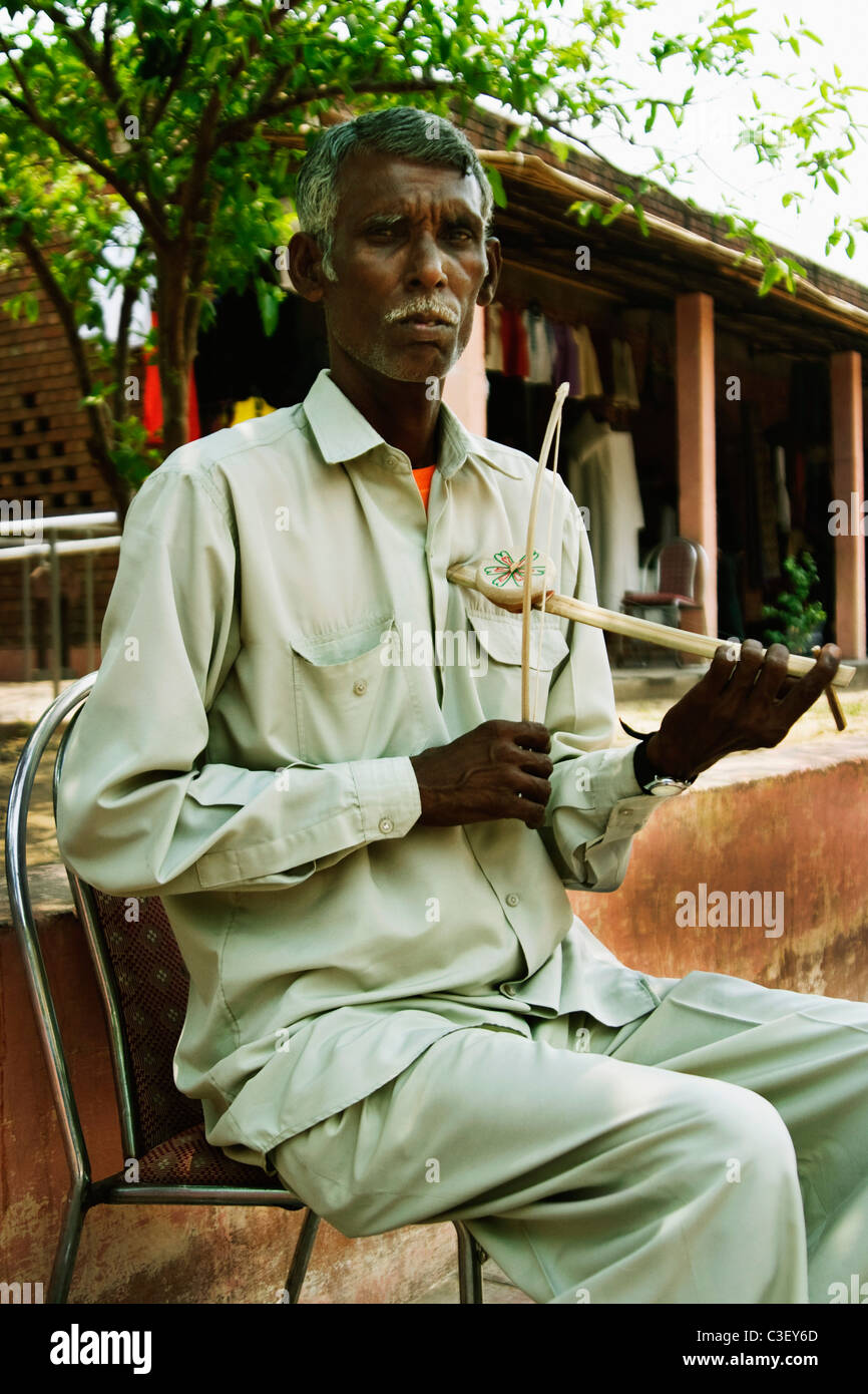 L'uomo gioca ektara, New Delhi, India Foto Stock