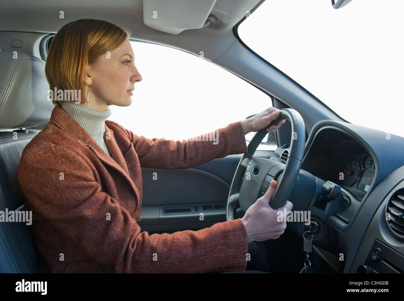 Donna alla guida di auto Foto Stock
